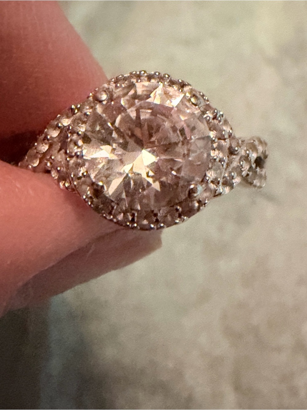 Brilliant white sapphire/ topaz halo ring in 14k white gold.